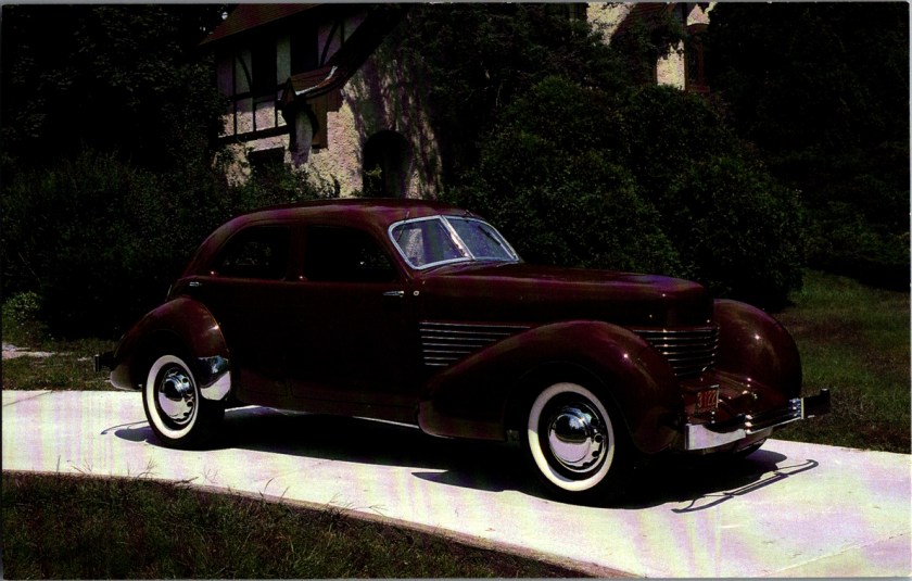 Vintage museum postcard front, 1936 Cord Armchair Beverly Sedan Model 810 8-cylinder front drive, Auburn Cord Duesenberg Museum, photography by Nicky Wright