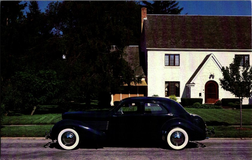 Vintage museum postcard front, 1937 Cord Beverly Sedan Model 812 8-cylinder front drive, Auburn Cord Duesenberg Museum, photography by Nicky Wright